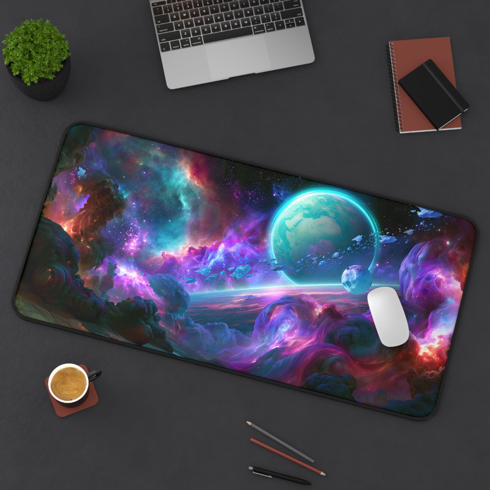 Ringfall deskmat — ringed planet rising through a teal and violet nebula, printed edge to edge on a neoprene desk mat