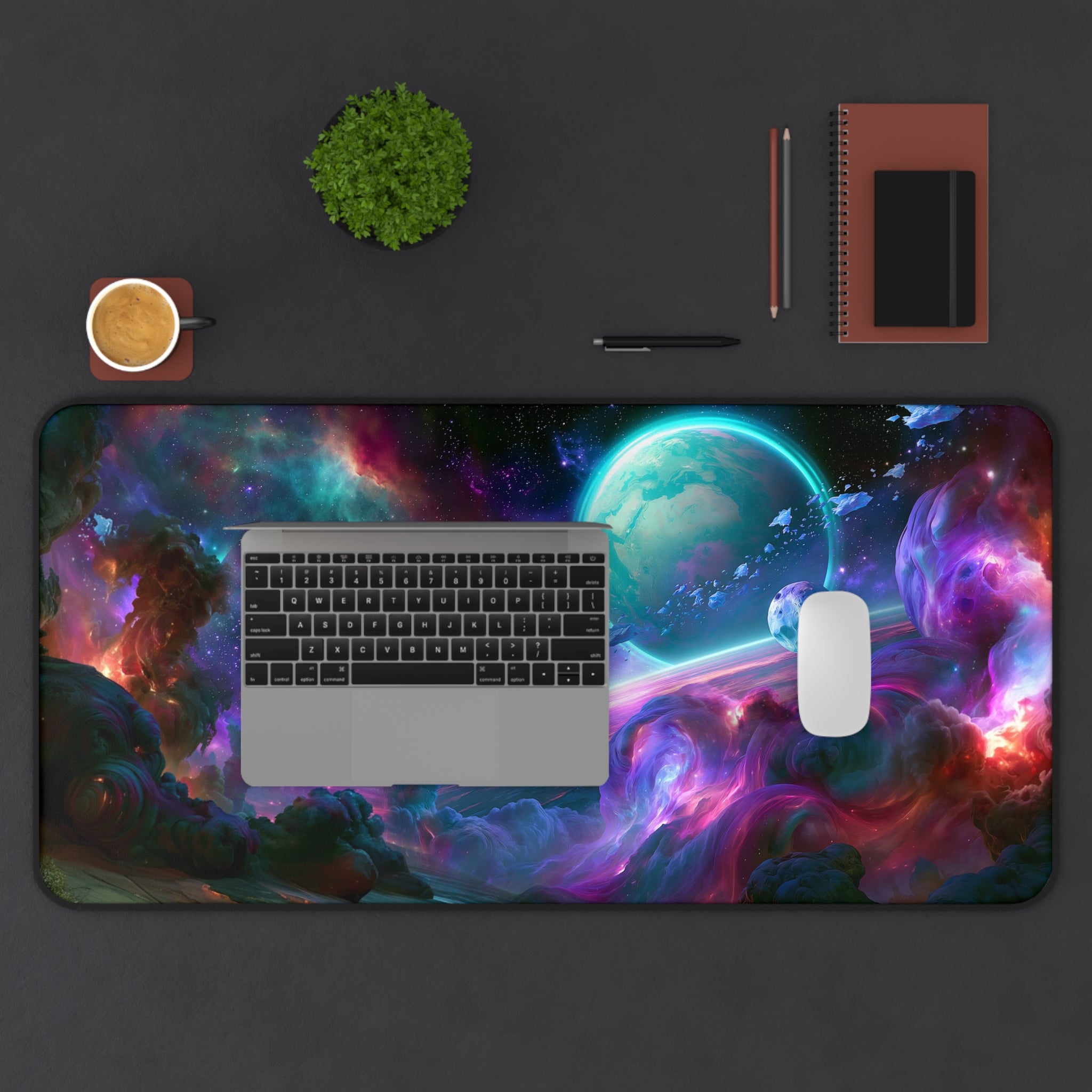 Ringfall deskmat — ringed planet rising through a teal and violet nebula, printed edge to edge on a neoprene desk mat