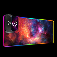 The Cradle RGB deskmat on a black background with a phone charging on the raised wireless module.