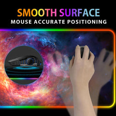 Hand using a mouse on The Cradle RGB deskmat, with a close-up inset of the mouse surface.