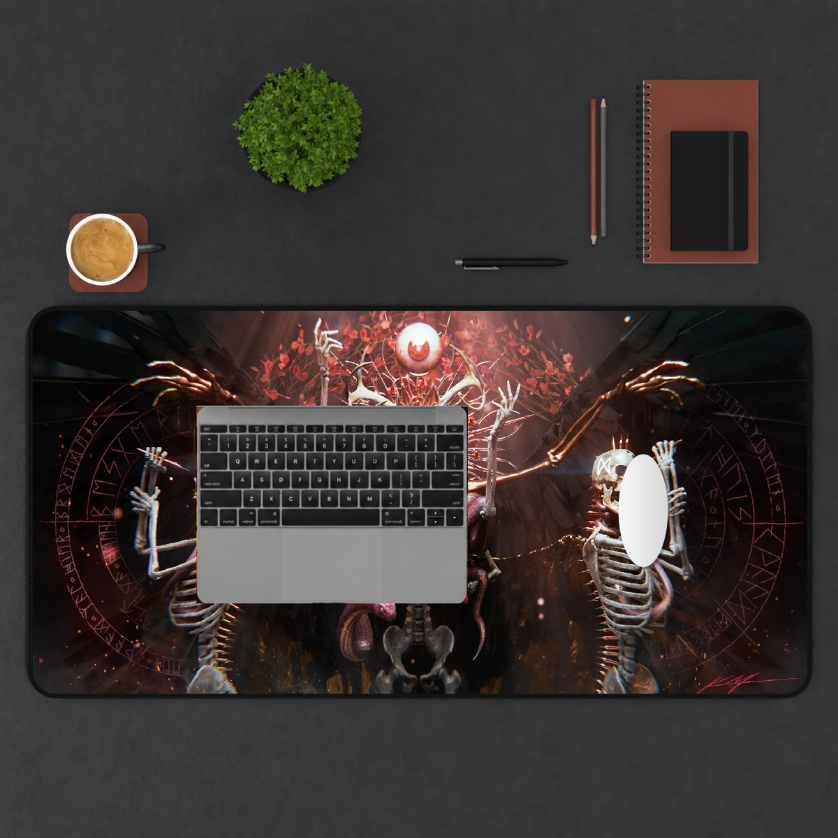 Icarus Rebirth printed mat in a top-down workspace.
